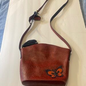 Women's Embossed Red Leather Crossbody Bag with Butterfly Accent